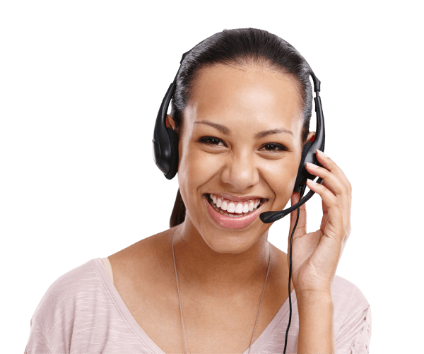 A person smiling while wearing a headset, appearing engaged in a conversation about scheduling a low-cost colonoscopy.