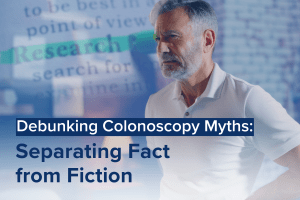 A healthcare professional discusses insurance coverage options for colonoscopy with an older male patient. The title reads: 'Insurance & Colonoscopies: Understanding Your Coverage.'