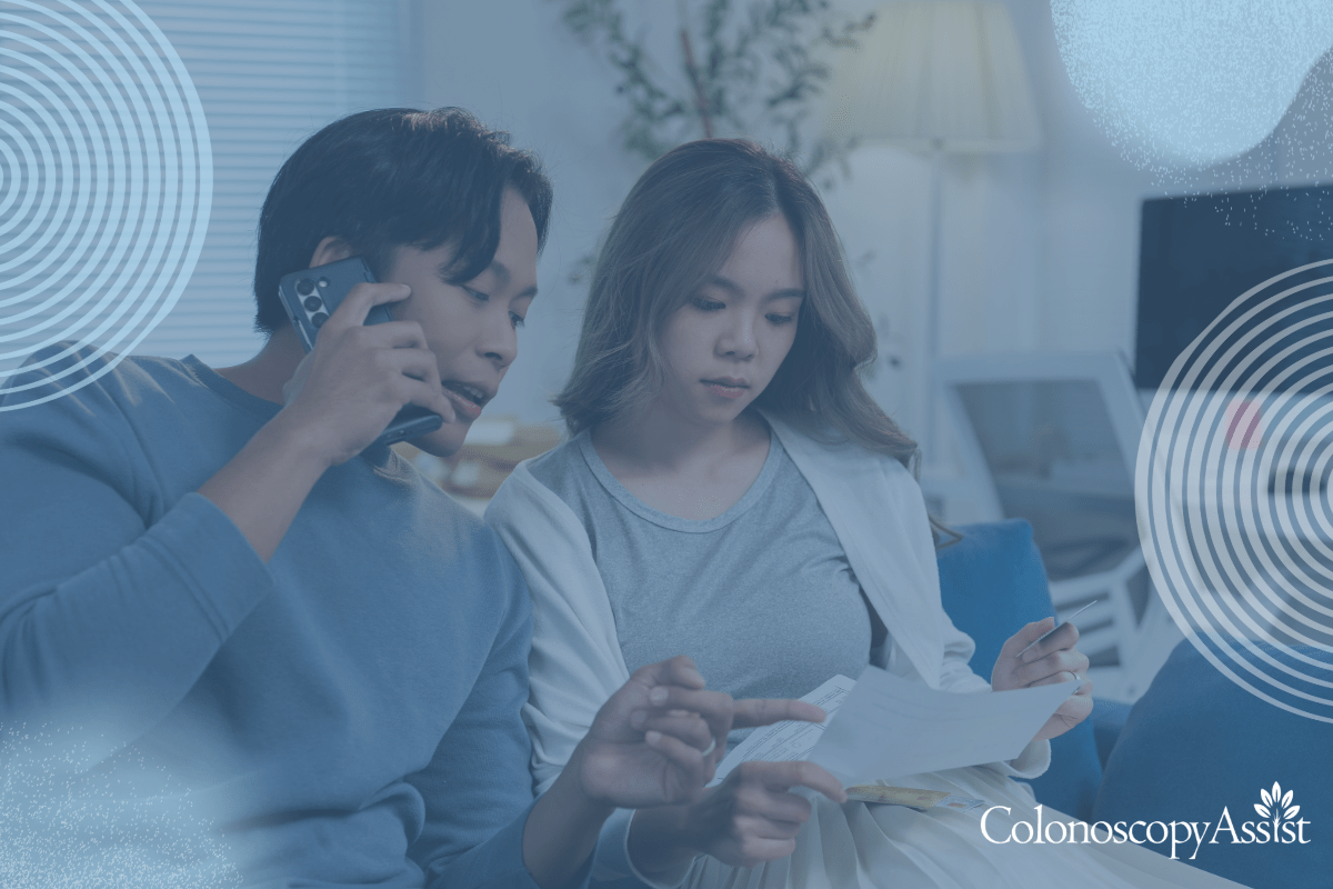 A man on the phone and a woman looking at documents sit together on a couch in a living room. The image has a blue overlay with circular designs in the corners.