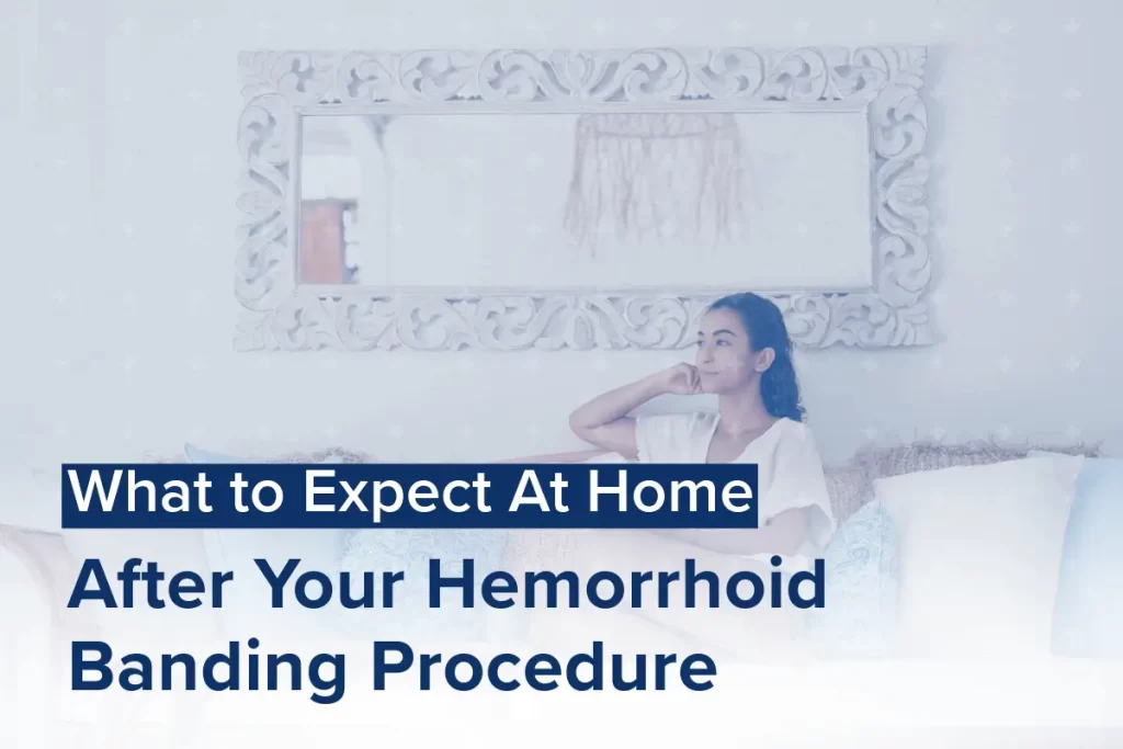 A woman sitting on a couch with a hand resting on her head, overlaid with text reading, What to Expect At Home After Your Hemorrhoid Banding Procedure: Tips for a Smooth Recovery.